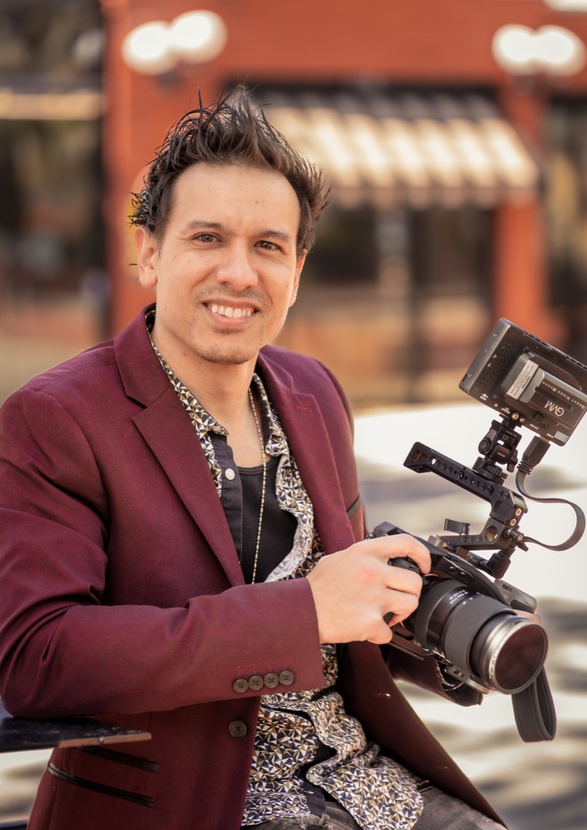 Mike Esser holding his camera